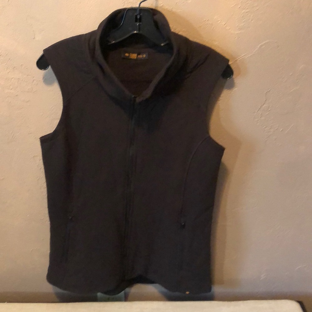 Medium weight black vest. New without tags. Cotton/poly blend material.